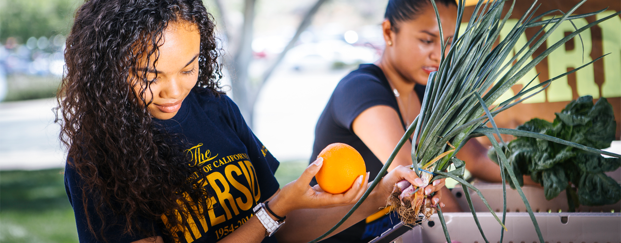 Woman holding an orange